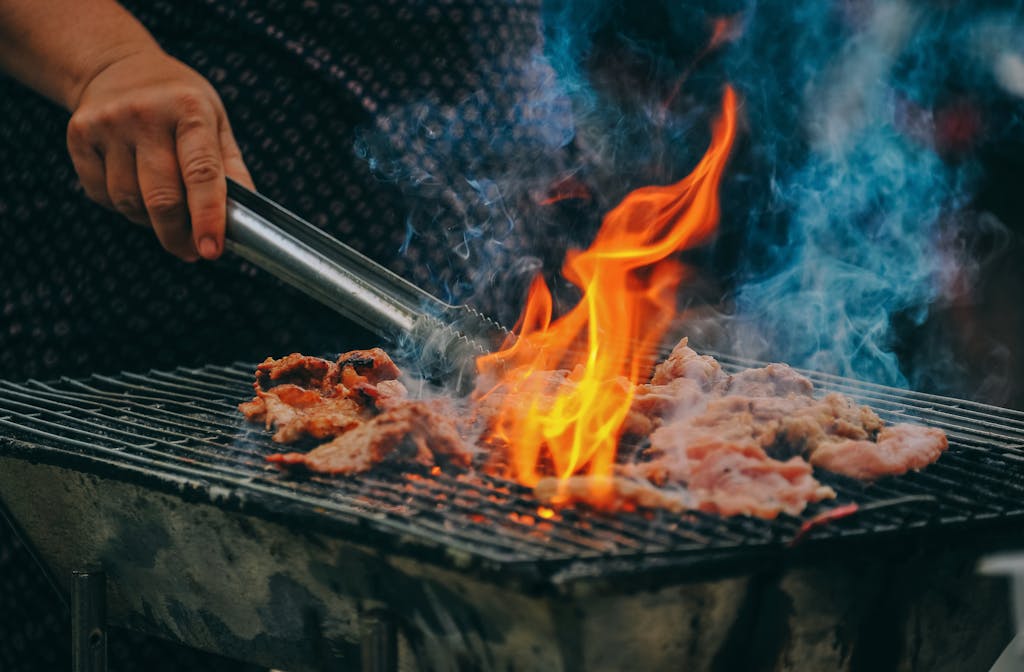 Unlock the Secrets and Elevate Your Craft. 50 Close-Up Photo of Man Cooking Meat