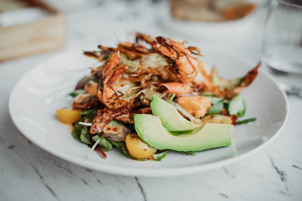 About 2 Seafood Based Dish Served on White Plate